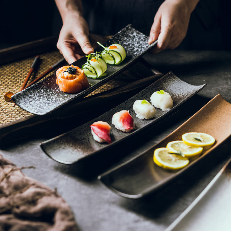 Reactive glaze detail on the Stoneward sushi boat plate, showing color that varies piece to piece