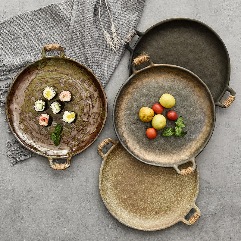 Hammered ceramic serving plate showing the dimpled textured surface catching the light