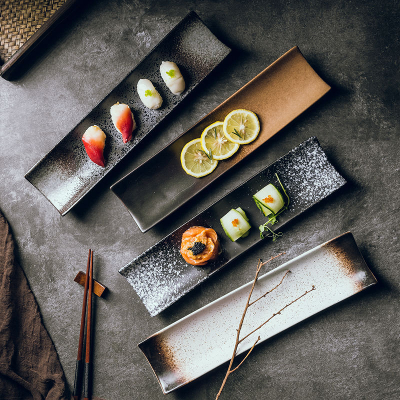 Stoneward Boat Sushi & Tasting Plate, a long narrow ceramic serving plate with a dark reactive glaze