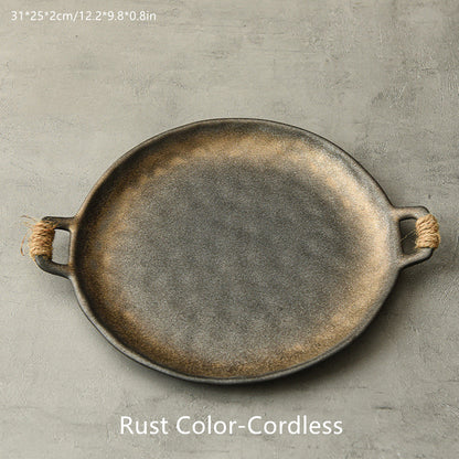 Hammered-glaze serving plate in gilt caramel and gold tones